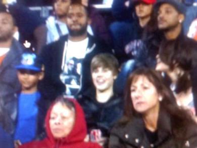 Justin Bieber with Selena Gomez to the right of him (side shot of Selena)